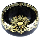 cuba de cerâmica preta com detalhes dourado
