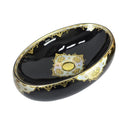 cuba de cerâmica preta com detalhes dourado