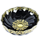 cuba de cerâmica preta com detalhes dourados