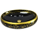 cuba de cerâmica preta com detalhes dourado